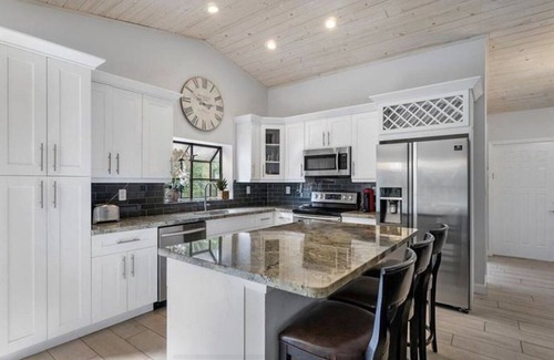 Lake Ida Shores House | Heated Saltwater Pool! Beautiful Activity Filled Three BR Home Downtown Delray