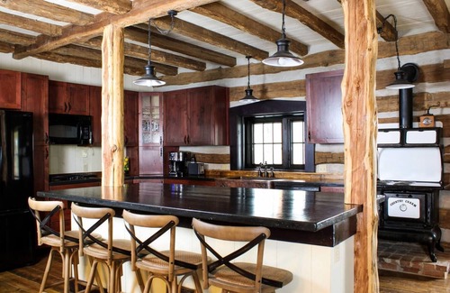 Treloar Cabin | Hidden Lake Log Cabin sleeps 18 - fire pit, double kitchens, outdoor seating