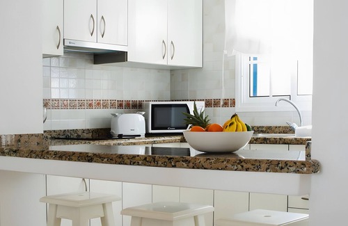 Arrieta House | Holiday Home 'Caleta Campos 2' with Sea View, Shared Pool and Wi-Fi