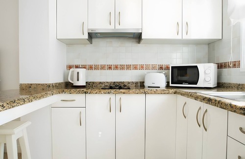 Arrieta House | Holiday Home 'Caleta Campos Bungalows' with Sea View, Shared Pool and Wi-Fi