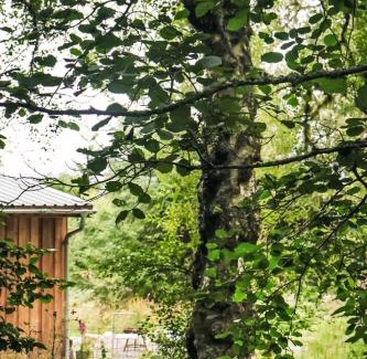 Bunloit House | Holiday Home G-Wilderness Cabin by Interhome