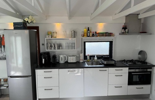 Onderdijk House | Holiday home in Wervershoof with terrace and garden