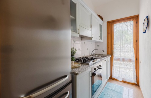 Torre dei Corsari House | Holiday Home 'Domu De Maria' with Sea View, Private Terrace and Air Conditioning