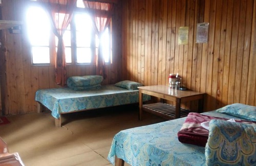 Rishop Cabin | Hollyhocks