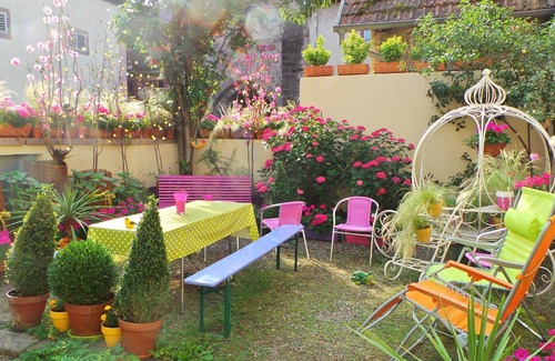 Ribeauville House | Home and garden in vibrant colored frame ready villagers living