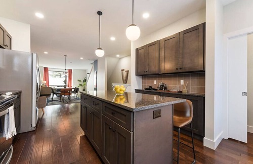 Central Northside House | ★ HostWise Stays ★ 3 King Beds! Garage! Theater! Great Location!