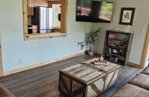 Tia Juana Cabin | Hot tub, boat dock and lakeside with this snug small cabin. TINY BEDROOMS