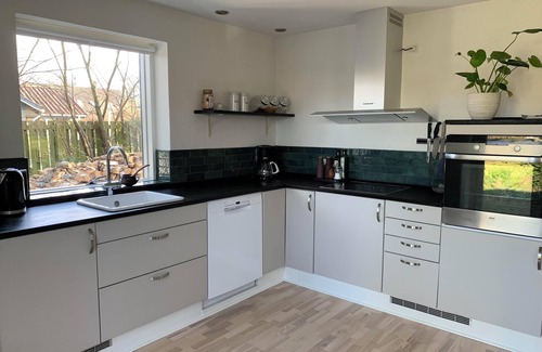 Rageleje House | In the charming coastal town of Rågeleje, this lovely holiday home is located.