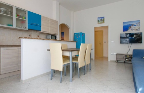 Lido Adriano Apartment | Inviting apartment with shared terrace and direct path to the sea.