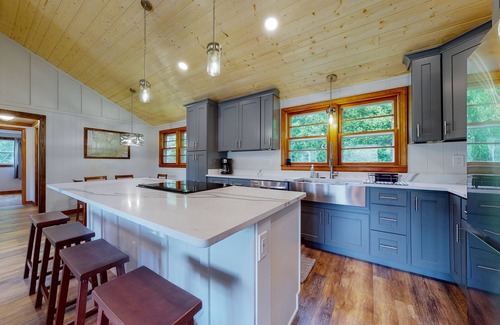 Penrose House | Inviting home with game room, firepit, full kitchen, central AC, & W/D