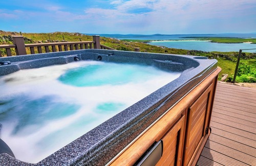 Roundstone Villa | Ireland's most spectacular view at ultra-luxury glass villa with deluxe hot tub.