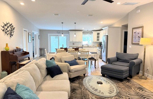 Butler Beach House | Island Escape - Water Views, Heated Pool, Boat Dock, Walk to Beach