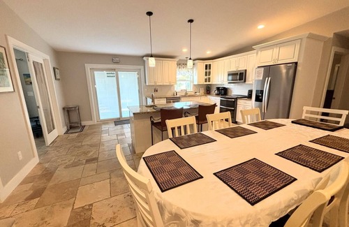 Butler Beach House | Island Escape - Water Views, Heated Pool, Boat Dock, Walk to Beach