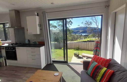 Mangonui House | Itzy Bitzy house is colourful, cosy, fully fenced with sea views