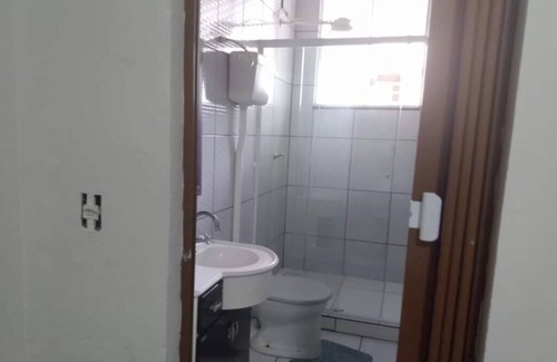 Barra Velha Apartment | Kitchenette near the beach with air conditioning.