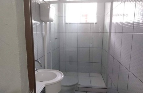 Barra Velha Apartment | Kitchenette near the beach with air conditioning.