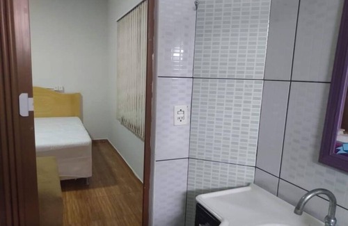 Barra Velha Apartment | Kitchenette near the beach with air conditioning.