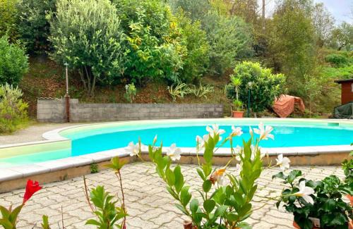 Ricco del Golfo di Spezia Apartment | La casa nel verde con piscina