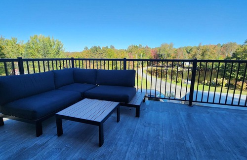 Saint-Prosper Ski Chalet | Lake and Pool table - The Dorchester