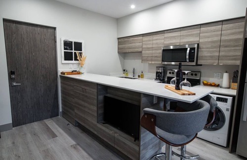 Vernon Apartment | Lake Okanagan beach condo w/private buoy, AC, heated outdoor pool, patio, SUPs