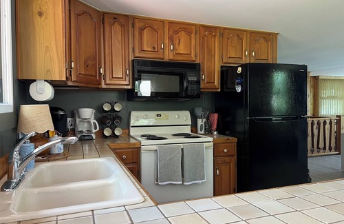 Canadian Lakes Cottage | Lakefront Escape with Hot Tub. Golf & Pool Access