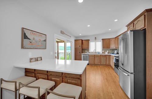 Hewitt House | Lakefront Haven Private Beach Dock Fire Pit Game Room Boat Rental