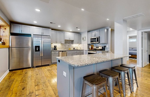 Channel Lake House | Lakefront home with firepit, 2 kitchens, & 2 W/Ds