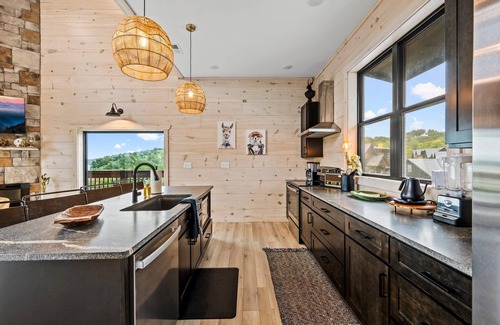 Sevierville Cabin | Lakefront home with retro accents, private pool, and private dock.