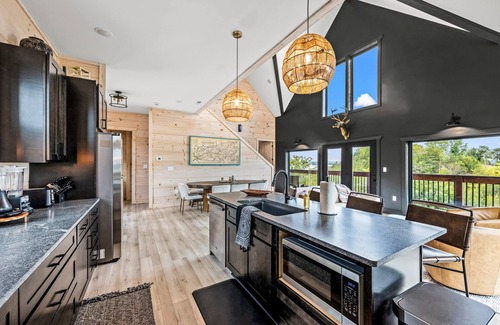 Sevierville Cabin | Lakefront home with retro accents, private pool, and private dock.