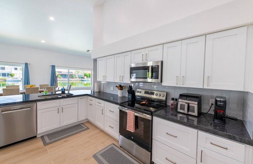 Val Vista Lakes House | Lakefront Lux by HomeSlice Stays