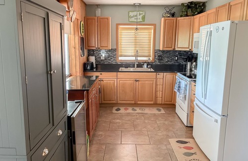 Mecosta Cottage | Lakefront Retreat | Hot Tub, Firepit, Kayaks, Dock & Spacious Outdoor Living