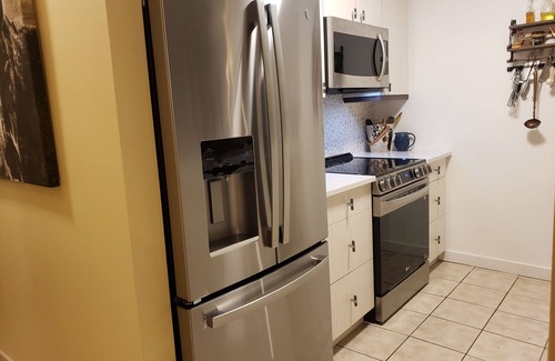 East Kootenay House | Lakefront townhome with outstanding mountain, and lake views and private deck