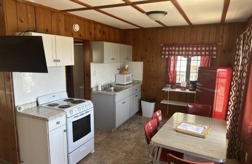 Lake Ozark House | Lakeshore Fishing Cabin 5, dock, boat slip and firepit area