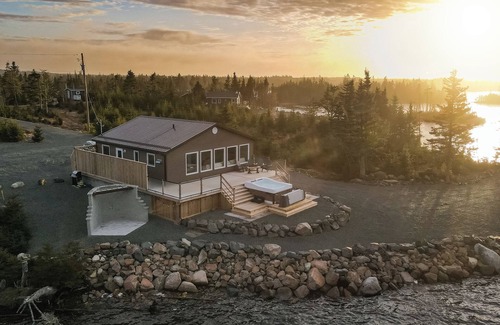 Saint Esprit Cottage | Lakeside Country Home with Handmade Wood Furniture, Hot Tub, Kayaks, 85”TV