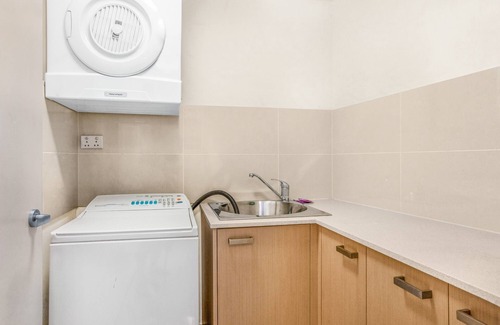 Merrimac Apartment | Lakeside Family Oasis with Pool, Gym and Balcony