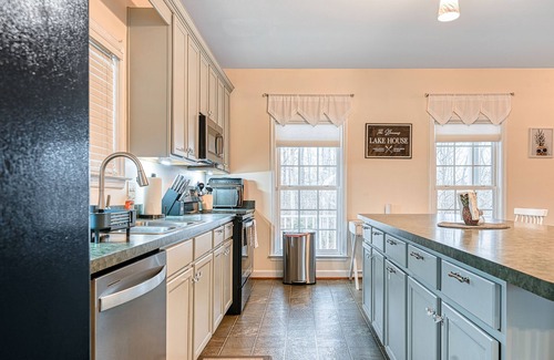 Orange House | Lakeside retreat with a firepit, dock, sprawling deck, pool table - dog friendly