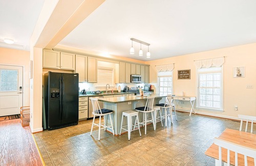 Orange House | Lakeside retreat with a firepit, dock, sprawling deck, pool table - dog friendly