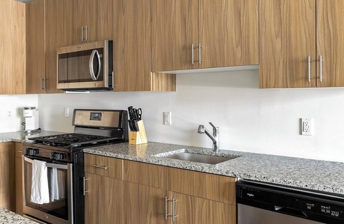 Carteret Apartment | Landing | Stylish 1BD, Rooftop Lounge, Gym