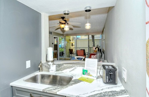 Longboat Key Apartment | LaPlaya 202E-Catch the gentle Gulf breezes on your private balcony beneath the swaying palms.