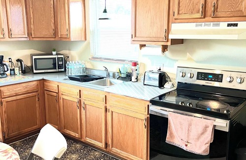 Columbus House | Large and neatly arranged house with a large parking lot .