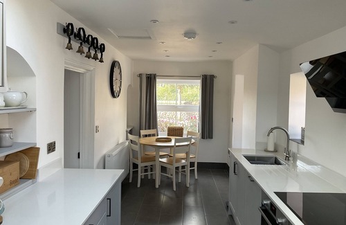 Bacton House | Large family house with private indoor heated pool in walking distance to beach.