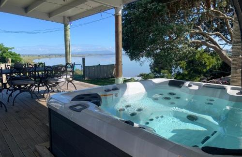 Te Kopuru Villa | Large riverfront home with spa and stage