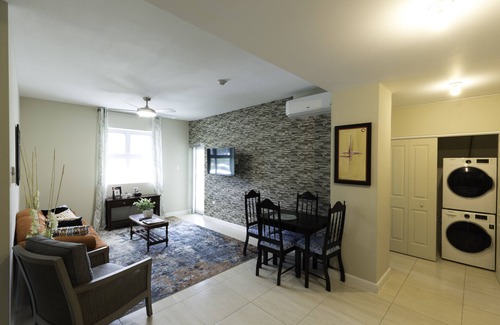 New Kingston Condo | "Le Luxe" Penthouse 2 BR condo w/AC, WiFi, complimentary Netflix & 24/7 sec