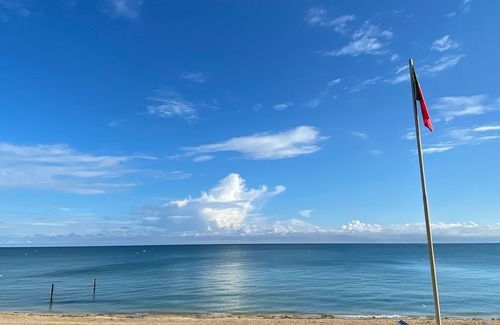 Saint-Regnobert-de-la-Cote-de-Nacre House | Les Papillons . at an alley of the sea