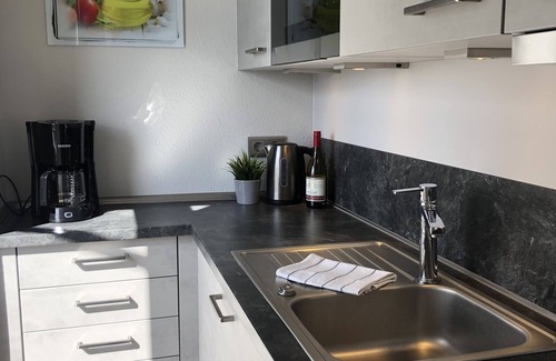 Busum Apartment | Light-flooded vacation apartment in the center with a view of the fishing boats