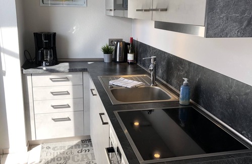 Busum Apartment | Light-flooded vacation apartment in the center with a view of the fishing boats