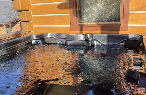 Dawson City House | Log cabin with large deck and 6 person hot tub