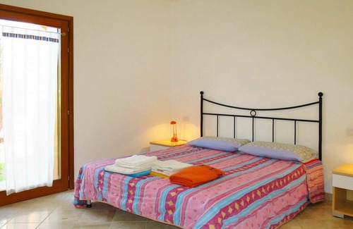 Porto Pozzo Apartment | Lovely apartment for 4 guests with pool, WIFI, A/C, terrace, pets allowed and parking