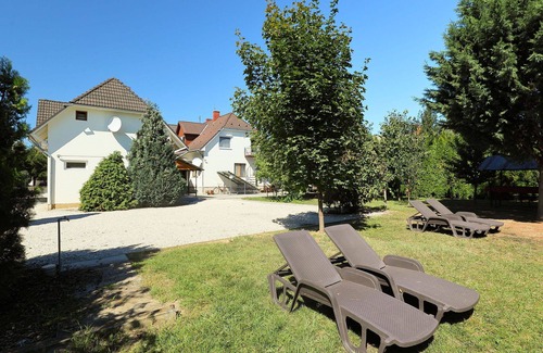 Balatonszemes Apartment | Lovely apartment for 15 people with WIFI, A/C, TV, patio, pets allowed and parking