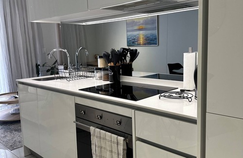 Greater Johannesburg Metropolitan Area Apartment | Luna Lux Apartment Elegant City Escape in Waterfall Smart City Walk to MOA